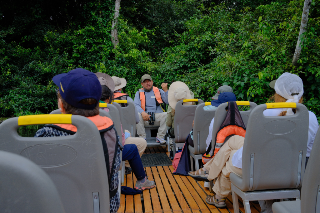 Guests on a small skiff excursion in the Peruvian Amazon led by a Delfín naturalist guide