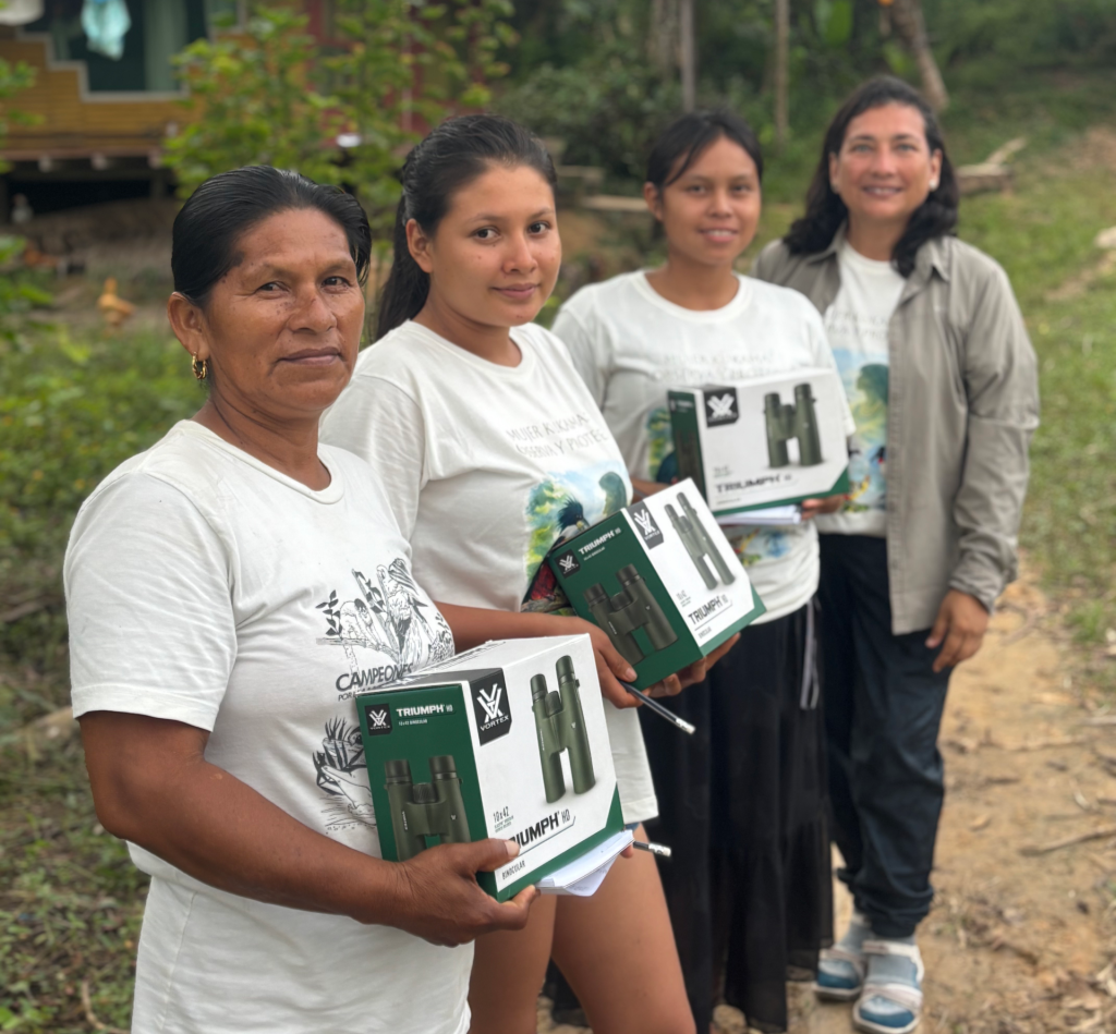 Women from Kukama communities receiving binoculars for birdwatching in the Amazon