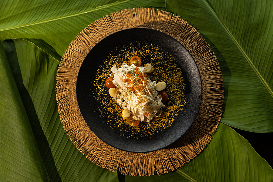 Local Amazon crew traveling by wooden boat along the river