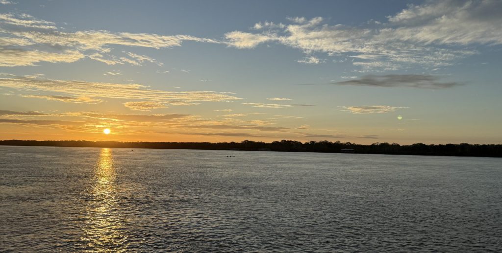 Golden sunset reflected across the Amazon River in Peru