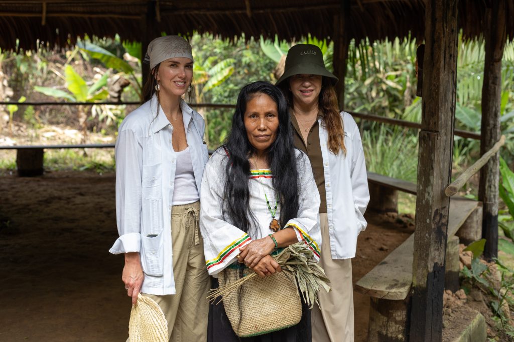 Delfín guests with a community member in the Peruvian Amazon