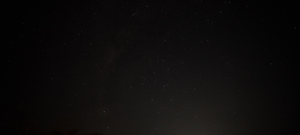 Starry night sky reflected over the river in Pacaya Samiria Reserve
