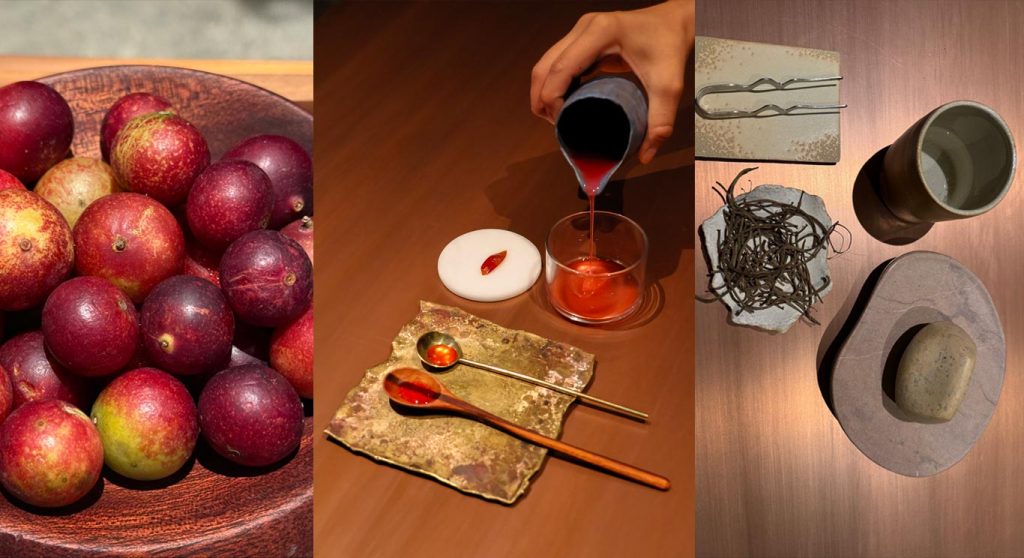 Red and purple camu camu fruits arranged in a wooden bowl.